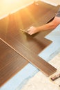 Man Installing New Laminate Wood Flooring Royalty Free Stock Photo