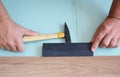 Man Installing New Laminate Wood Flooring. Worker Installing wooden laminate flooring with Copy Space. Royalty Free Stock Photo