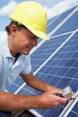 Man installing solar panels Royalty Free Stock Photo