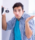 Man installing surveillance CCTV cameras at home Royalty Free Stock Photo