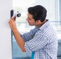 Man installing surveillance CCTV cameras at home Royalty Free Stock Photo