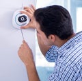 Man installing surveillance CCTV cameras at home Royalty Free Stock Photo