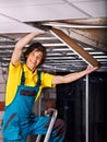 Man installing suspended ceiling Royalty Free Stock Photo