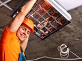 Man installing suspended ceiling Royalty Free Stock Photo