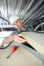 Man installing suspended ceiling Royalty Free Stock Photo