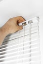 Man installing venetian blinds. Royalty Free Stock Photo