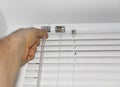 Man installing venetian blinds. Royalty Free Stock Photo