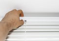 Man installing venetian blinds. Royalty Free Stock Photo