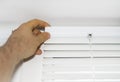 Man installing venetian blinds. Royalty Free Stock Photo