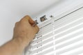 Man installing venetian blinds. Royalty Free Stock Photo