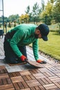 A man installing wood floor planks, building a beautiful terrace Royalty Free Stock Photo