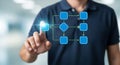 Man Interacting with Digital Flowchart Demonstrating Process and Workflow Management Royalty Free Stock Photo