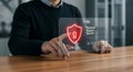Man Interacting with Firewall Security Interface on Transparent Display Screen