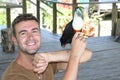 Man interacting with a gorgeous toucan bird