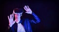 Man interacting with vr glasses dark isolated background