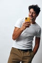 Lifestyle man white casual message online t-shirt hipster confident portrait technology phone