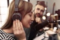 Man interviewing young woman in modern radio studio Royalty Free Stock Photo