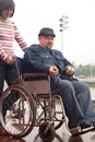 Man in an invalid carriage Royalty Free Stock Photo
