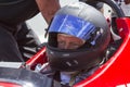 Man in IRL race car with helmet Royalty Free Stock Photo