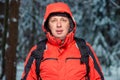 Man in a jacket on a hike with a backpack