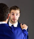 Man in jacket listening his business partner with surprised face