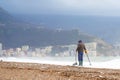 Man look for old historical values since war ancient coins with metal detector