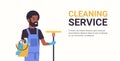 Man janitor holding bucket with tools and mop cleaning service concept smiling african american male cleaner portrait Royalty Free Stock Photo