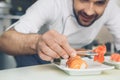 Man japanese restaurant chef cooking in the kitchen Royalty Free Stock Photo