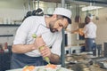 Man japanese restaurant chef cooking in the kitchen Royalty Free Stock Photo