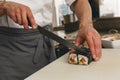 Close up of man japanese restaurant chef cooking sushi in the kitchen Royalty Free Stock Photo