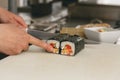 Close up of man japanese restaurant chef cooking sushi in the kitchen Royalty Free Stock Photo