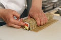 Close up of man japanese restaurant chef cooking sushi in the kitchen Royalty Free Stock Photo