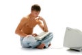 Man in jeans with computer Royalty Free Stock Photo