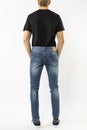 Man in jeans, denim pants close up on white background, blue jeans