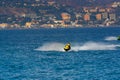 Man on jet ski jumping on the wave