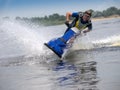 Man on jet ski skims along camera Royalty Free Stock Photo