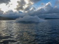 Man on jet ski turns with much splashes. Teen age boy skiing on water scooter. Young man on personal watercraft in tropical sea. A