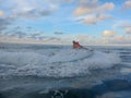 Man on jet ski turns with much splashes. Teen age boy skiing on water scooter. Young man on personal watercraft in tropical sea. A