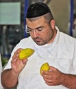 The  man - Jew  considers a citrus Royalty Free Stock Photo