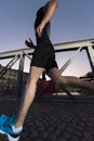 Man jogging across the bridge in the city Royalty Free Stock Photo