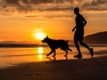 A man is jogging by the beach while being accompanied by his beloved dog. Royalty Free Stock Photo