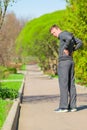 Man while jogging have begun back pain