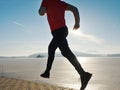 Man jogging at his girlfriend at river bank.  Hills with hot Sun Royalty Free Stock Photo