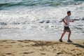 A man jogs along the shore. Royalty Free Stock Photo