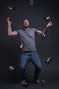 A man juggles with empty cans.