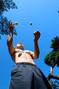 Man juggling with balls at the park