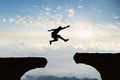 Man jump Mountain cliff morning mountain sky and fog Royalty Free Stock Photo