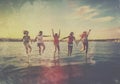 man jump ocean fun friend happiness youth vacation sunset sea group. Generative AI. Royalty Free Stock Photo