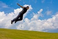 Man jump over meadow