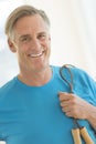 Man With Jump Rope Smiling In Health Club Royalty Free Stock Photo